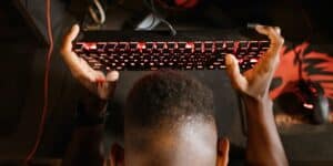 overhead shot of a man holding his mechanical keyboard